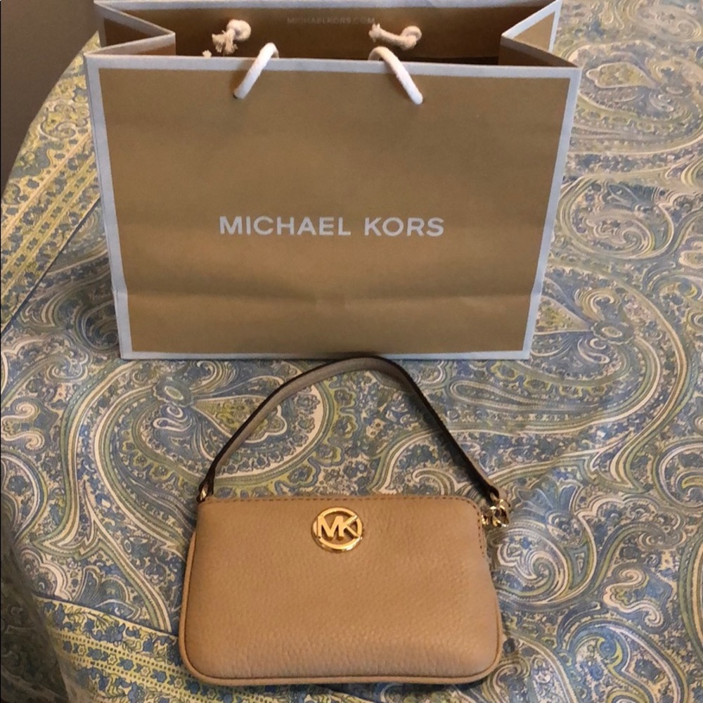 Brand-new Michael Kors tan, leather wristlet.